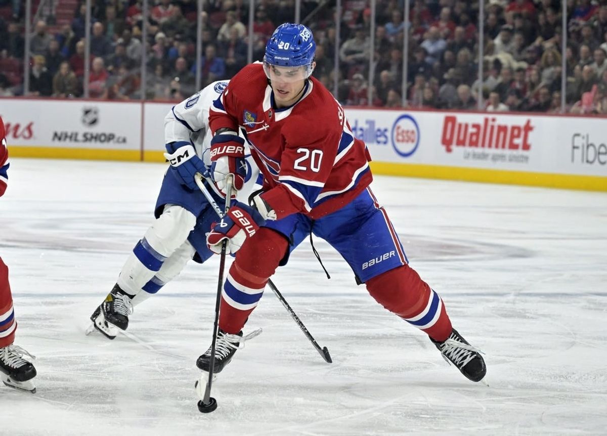 Nov 7, 2023; Montreal, Quebec, CAN; Montreal Canadiens forward Juraj Slafkovsky (20) plays the puck during the third period of the game against the Tampa Bay Lightning at the Bell Centre.