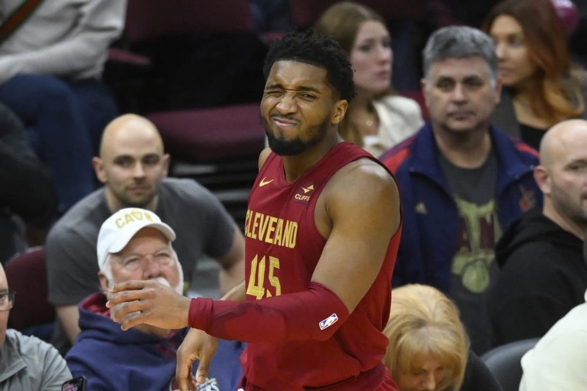 Jan 31, 2024; Cleveland, Ohio, USA; Cleveland Cavaliers guard Donovan Mitchell (45) reacts after he was hit in the face in the fourth quarter against the Detroit Pistons at Rocket Mortgage FieldHouse.