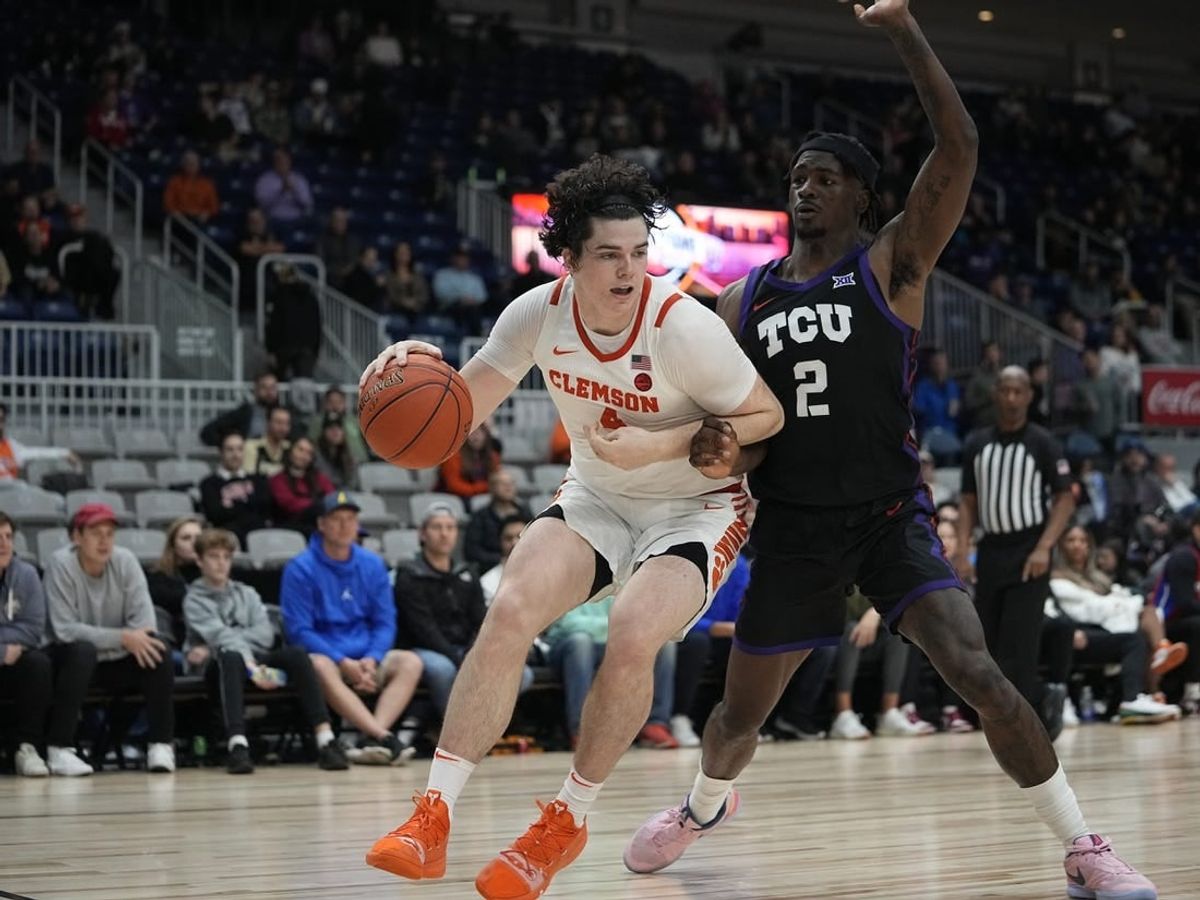Dec 9, 2023; Toronto, Ontario, CAN; Clemson Tigers forward Ian Schieffelin (4) drives to the net against TCU Horned Frogs forward Emanuel Miller (2) during the second half at Coca-Cola Coliseum.