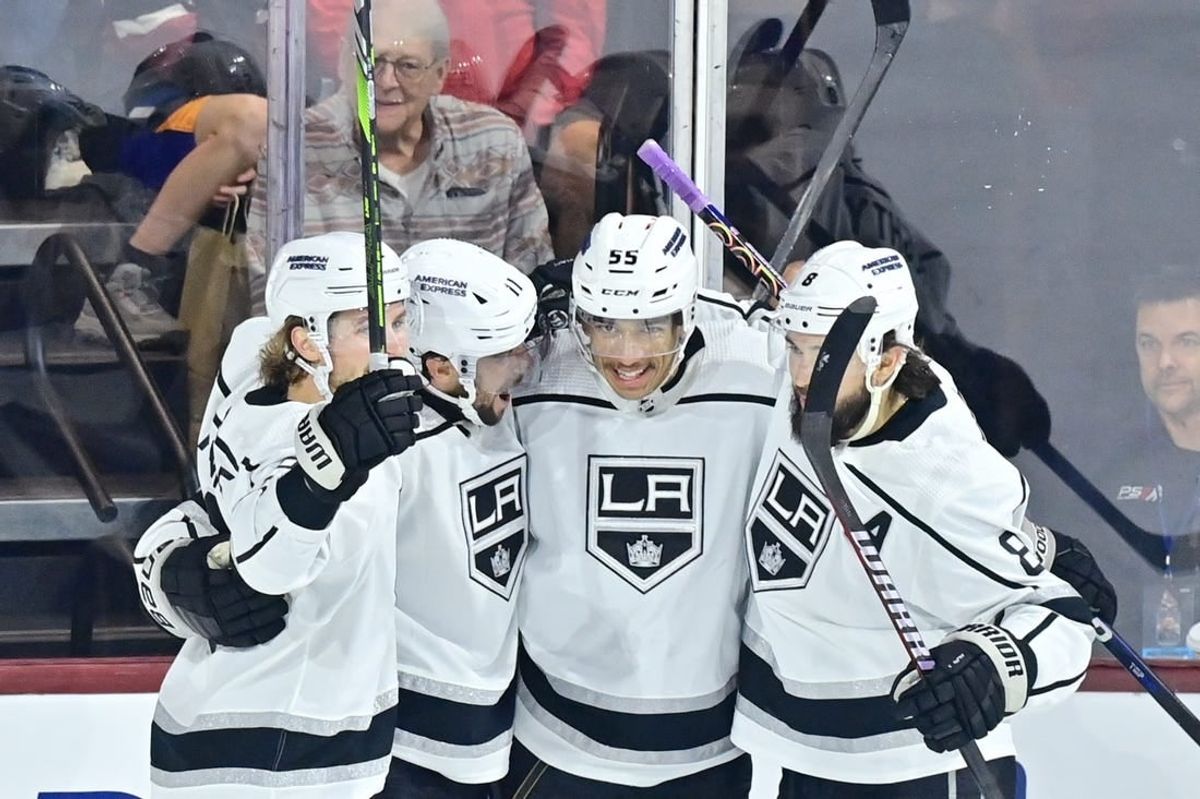 Nov 20, 2023; Tempe, Arizona, USA; Los Angeles Kings center Anze Kopitar (11) celebrates with defenseman Drew Doughty (8), center Quinton Byfield (55) and center Adrian Kempe (9) after scoring a goal against the  Arizona Coyotes in the first period at Mullett Arena.