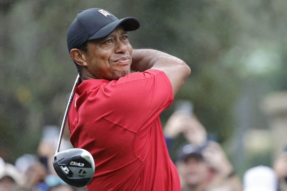 Dec 17, 2023; Orlando, Florida, USA;  Tiger Woods plays his shot from the first tee during the PNC Championship at The Ritz-Carlton Golf Club.