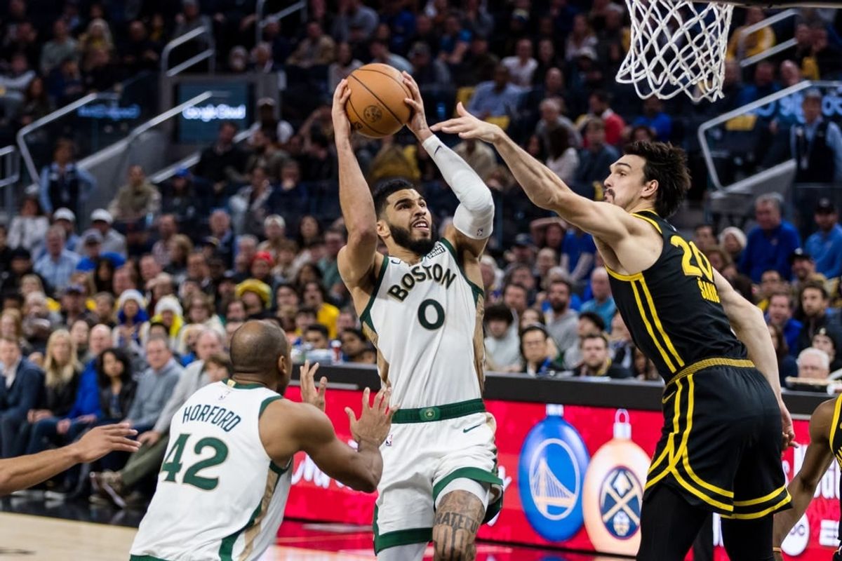 Dec 19, 2023; San Francisco, California, USA; Golden State Warriors forward Dario Saric (20) defends Boston Celtics forward Jayson Tatum (0) during the second half at Chase Center.