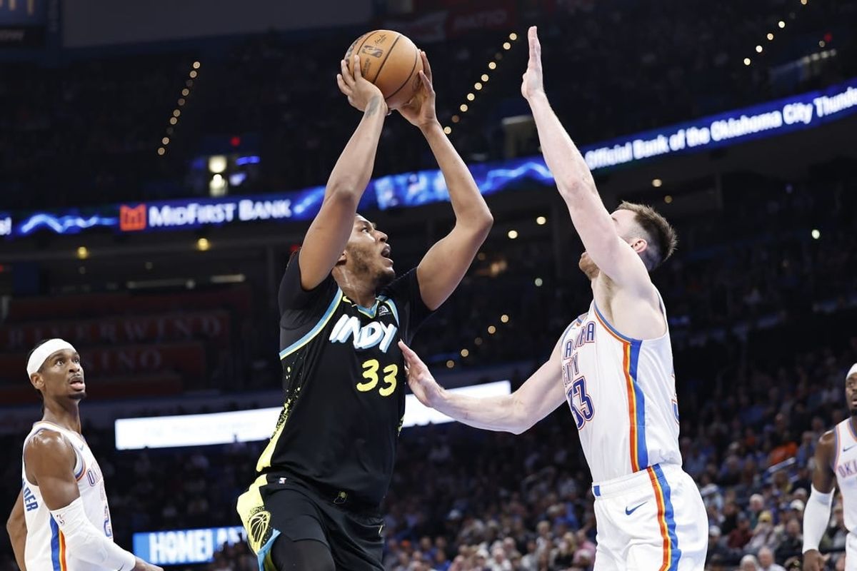 Mar 12, 2024; Oklahoma City, Oklahoma, USA; Indiana Pacers center Myles Turner (33) shoots as Oklahoma City Thunder forward Gordon Hayward (33) defends during the second half at Paycom Center.