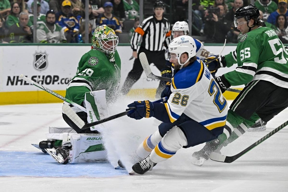 Apr 17, 2024; Dallas, Texas, USA; Dallas Stars goaltender Jake Oettinger (29) and defenseman Thomas Harley (55) stops shot by St. Louis Blues left wing Nathan Walker (26) during the first period at the American Airlines Center.