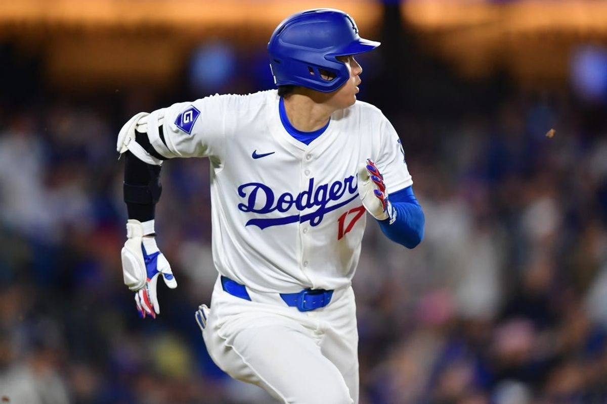Apr 3, 2024; Los Angeles, California, USA; Los Angeles Dodgers designated hitter Shohei Ohtani (17) runs out a fly ball against the San Francisco Giants during the fourth inning at Dodger Stadium.