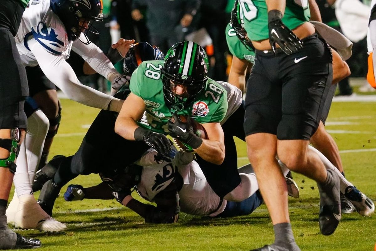 Dec 19, 2023; Frisco, TX, USA; Marshall Thundering Herd running back Ethan Payne (28) scores a touchdown during the first quarter against the UTSA Roadrunners at Toyota Stadium.