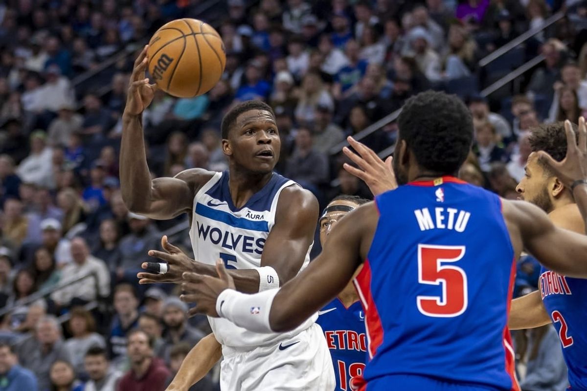 Mar 27, 2024; Minneapolis, Minnesota, USA; Minnesota Timberwolves guard Anthony Edwards (5) drives towards the basket and passes the ball against the Detroit Pistons in the first half at Target Center.
