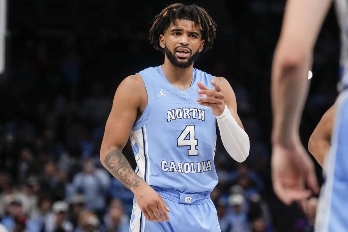 Dec 20, 2023; Charlotte, North Carolina, USA; North Carolina Tar Heels guard RJ Davis (4) talks to a teammate during a foul shot against the Oklahoma Sooners during the second half at Spectrum Center.