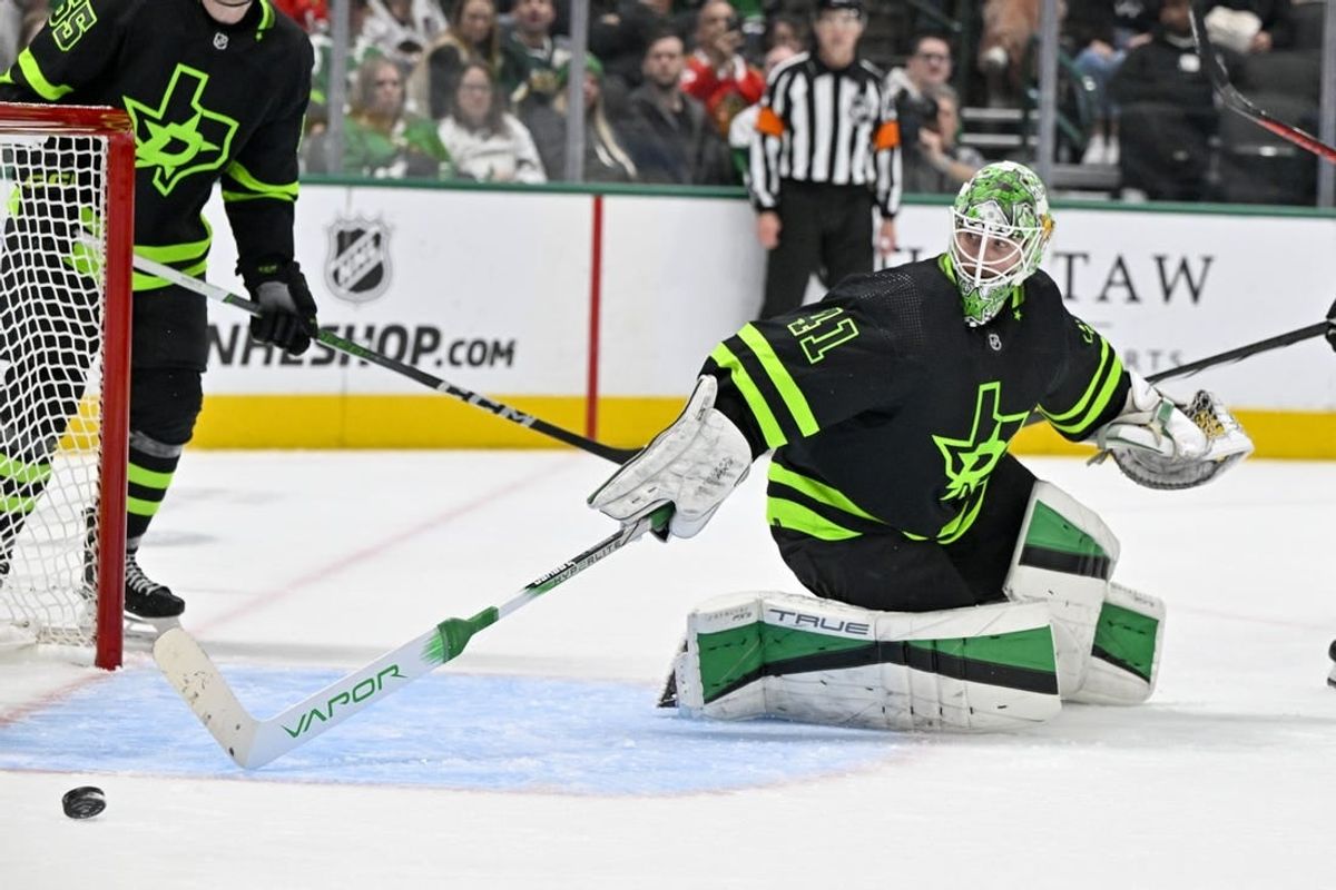 Dec 31, 2023; Dallas, Texas, USA; Dallas Stars goaltender Scott Wedgewood (41) makes a stick save against the Chicago Blackhawks during the third period at the American Airlines Center.