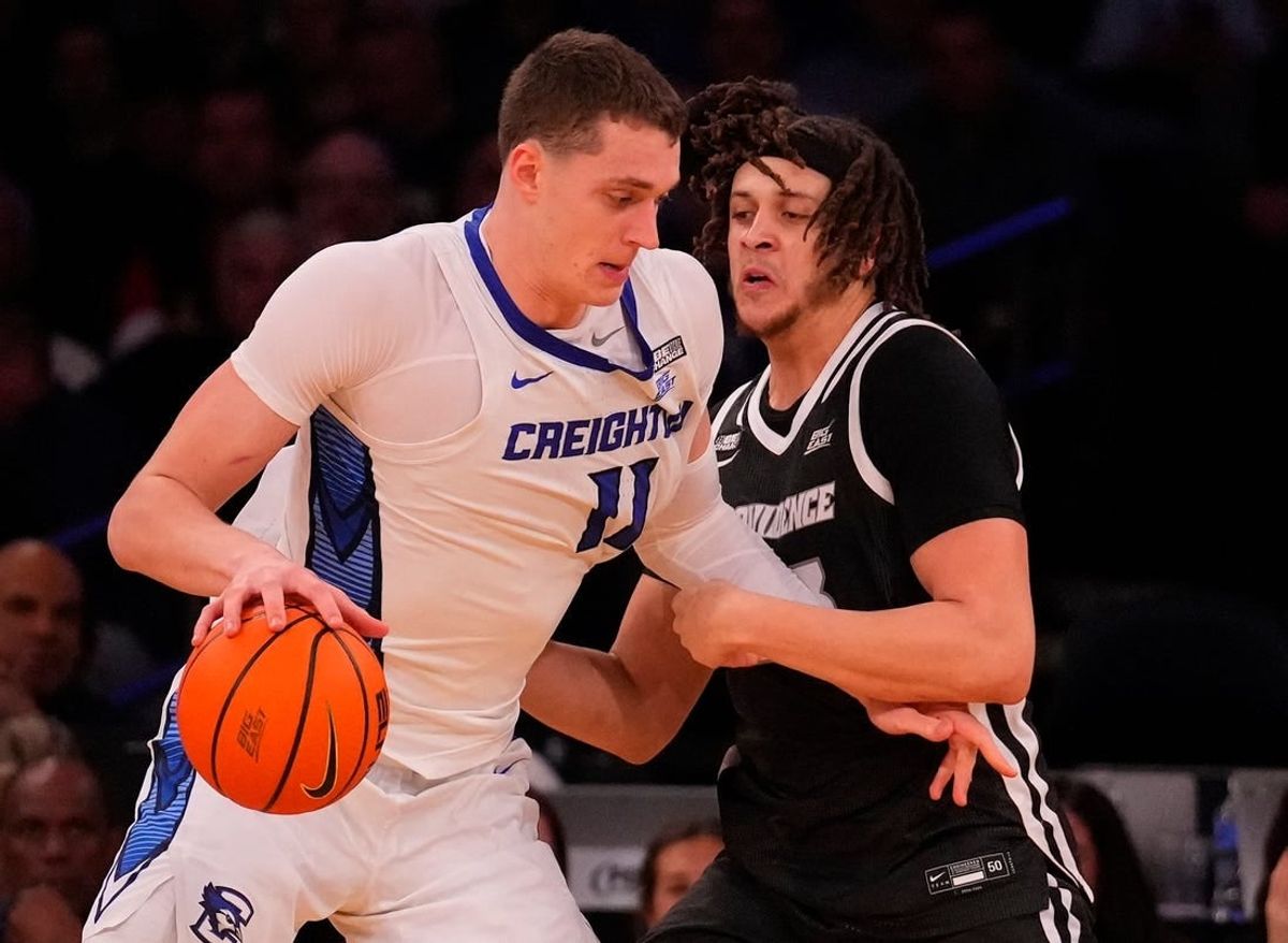 Mar 14, 2024; New York City, NY, USA;  Creighton Bluejays center Ryan Kalkbrenner (11) and Providence Friars forward Josh Oduro (13) square off during the second half at Madison Square Garden.