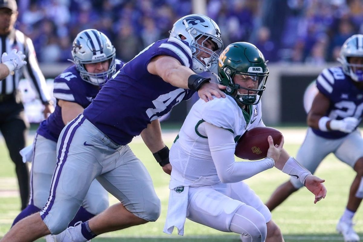 Nov 11, 2023; Manhattan, Kansas, USA; Baylor Bears quarterback Blake Shapen (12) is sacked by Kansas State Wildcats defensive end Cody Stufflebean (47) during the second quarter at Bill Snyder Family Football Stadium.