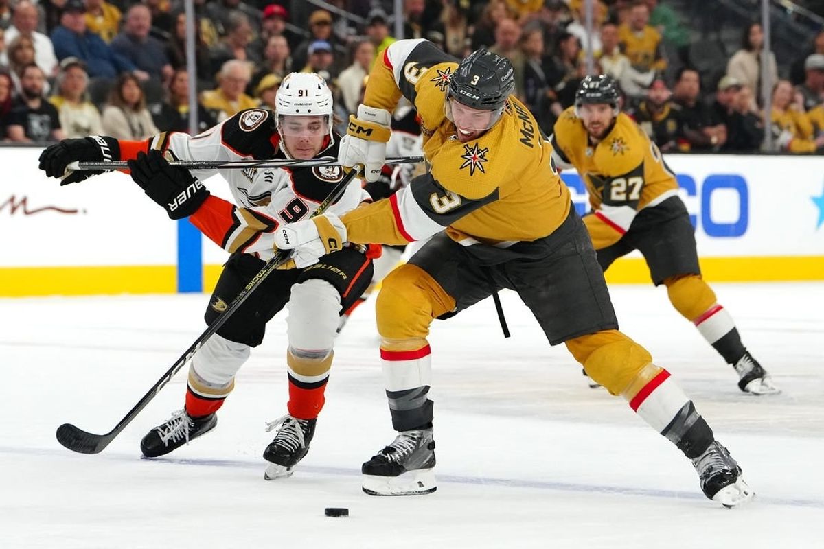 Apr 18, 2024; Las Vegas, Nevada, USA; Vegas Golden Knights defenseman Brayden McNabb (3) looks to sweep the puck away from Anaheim Ducks center Leo Carlsson (91) during the first period at T-Mobile Arena.