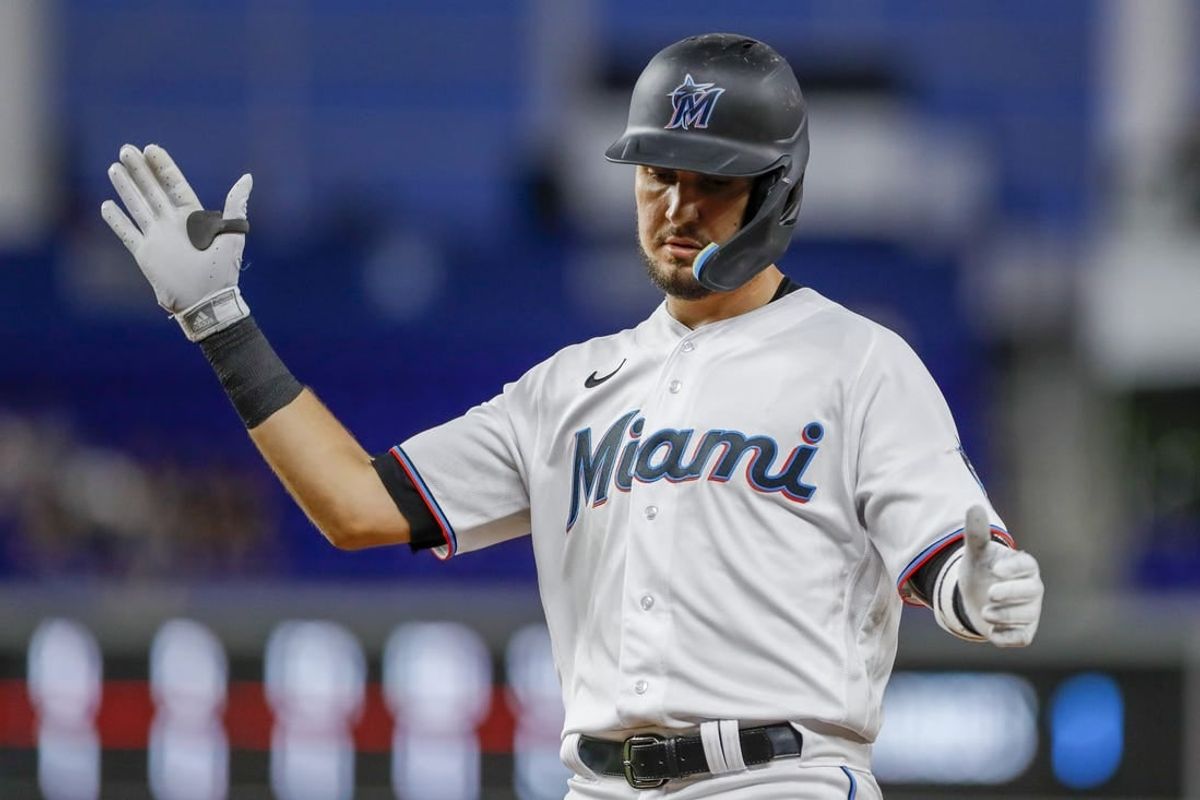 Sep 21, 2022; Miami, Florida, USA; Miami Marlins third baseman Jordan Groshans (65) reacts from first base after hitting a single during the third inning against the Chicago Cubs at loanDepot Park.