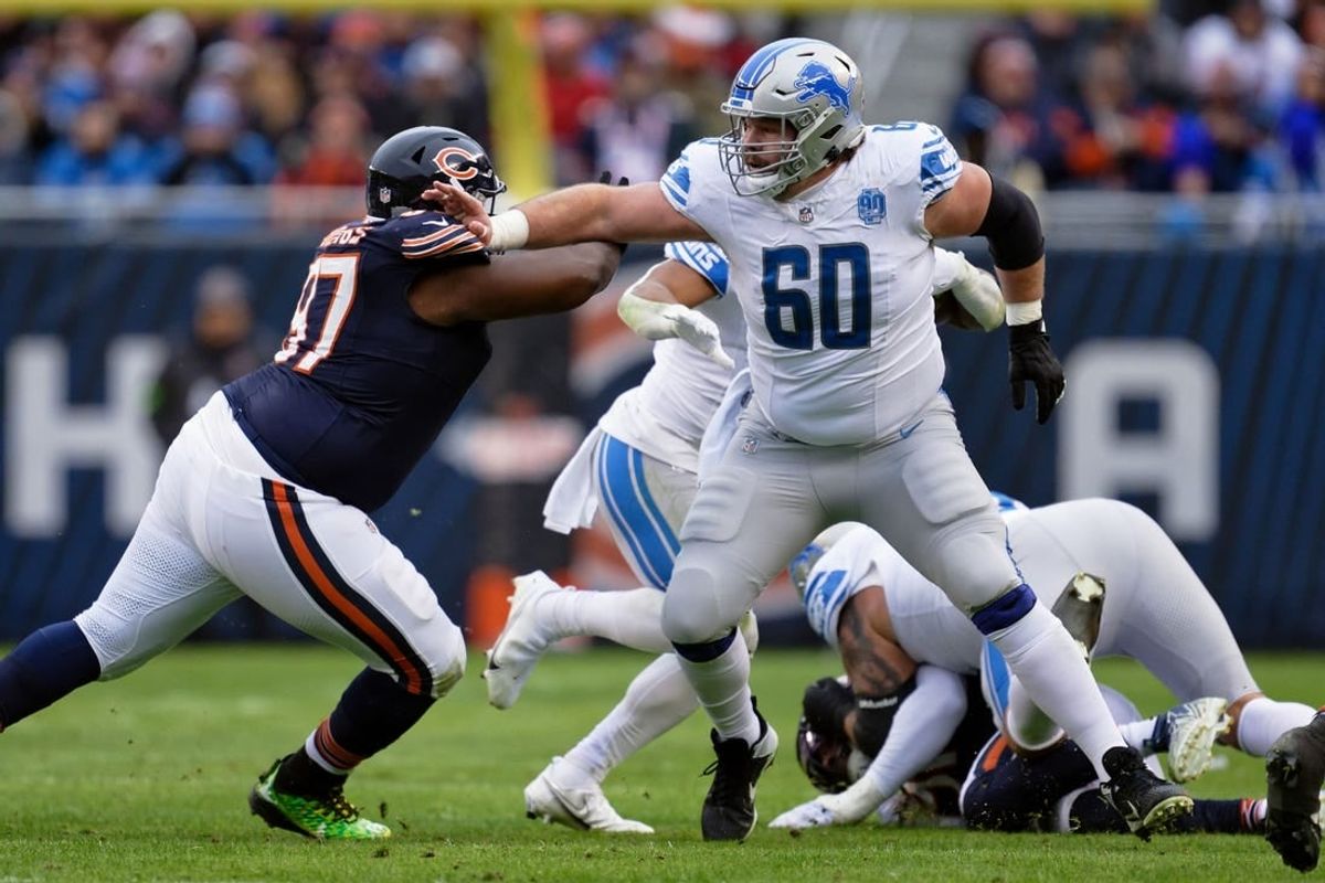 Dec 10, 2023; Chicago, Illinois, USA;  Detroit Lions offensive lineman Graham Glasgow (60) blocks against the Chicago Bears at Soldier Field.