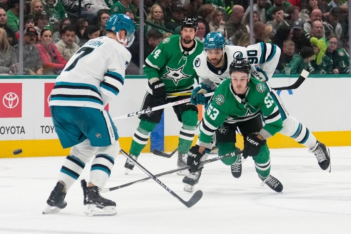 Mar 2, 2024; Dallas, Texas, USA;  Dallas Stars center Wyatt Johnston (53) and San Jose Sharks right wing Justin Bailey (90) chase the puck during the second period at American Airlines Center.