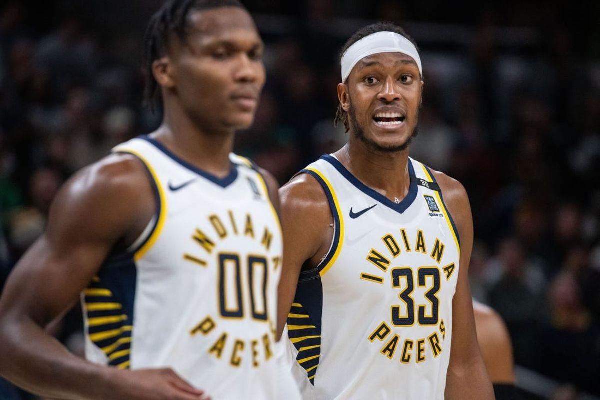 Jan 8, 2024; Indianapolis, Indiana, USA; Indiana Pacers center Myles Turner (33) talks to guard Bennedict Mathurin (00) after a timeout  in the second half against the Boston Celtics at Gainbridge Fieldhouse.