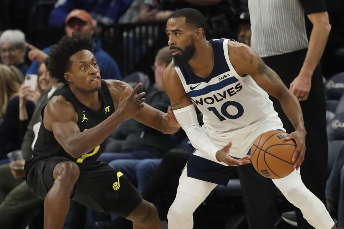 Nov 30, 2023; Minneapolis, Minnesota, USA; Utah Jazz guard Collin Sexton (2) defends against the Minnesota Timberwolves guard Mike Conley (10) in the fourth quarter at Target Center.