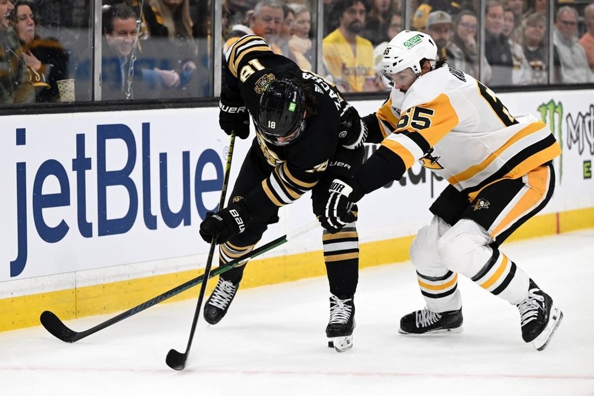 Mar 9, 2024; Boston, Massachusetts, USA; Pittsburgh Penguins center Noel Acciari (55) defends Boston Bruins center Pavel Zacha (18) during the first period at the TD Garden.