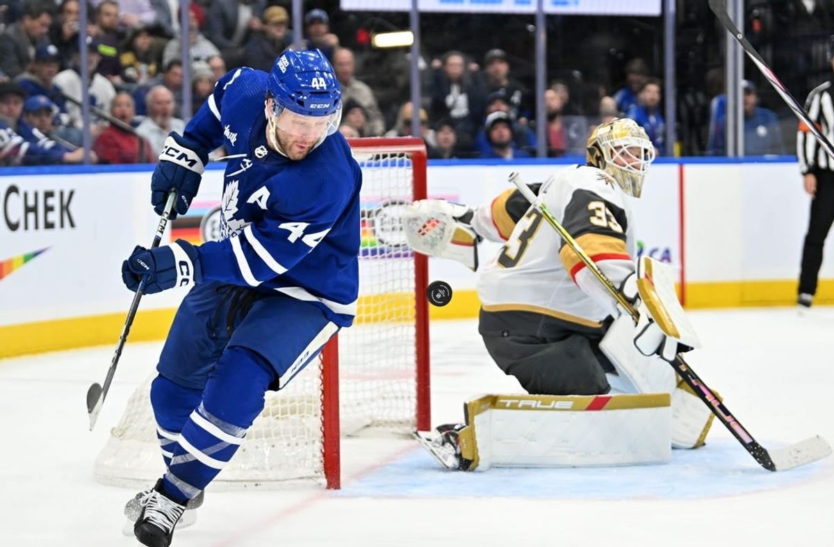 Feb 27, 2024; Toronto, Ontario, CAN;  Toronto Maple Leafs defenseman Morgan Rielly (44) chases the puck after a save and rebound from Vegas Golden Knights goalie Adin Hill (33) in the third period at Scotiabank Arena.