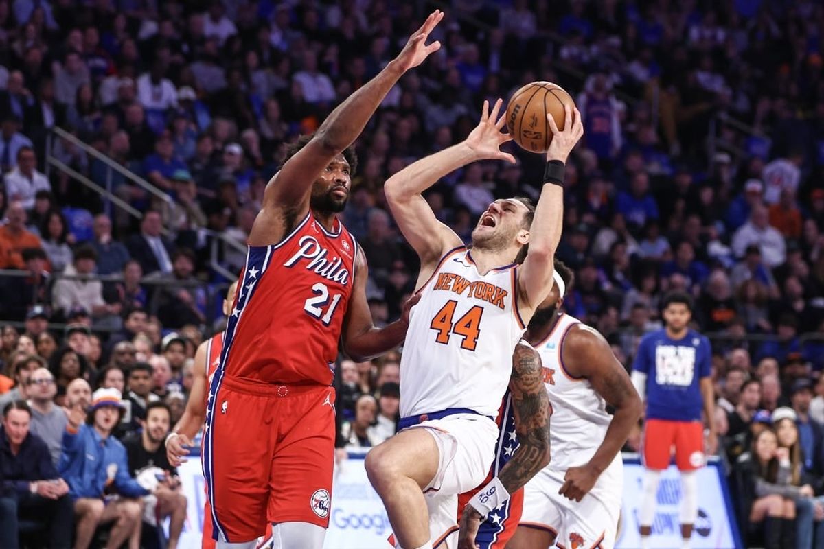 Apr 20, 2024; New York, New York, USA; New York Knicks forward Bojan Bogdanovic (44) looks to drive past Philadelphia 76ers center Joel Embiid (21) in the first quarter during game one of the first round for the 2024 NBA playoffs at Madison Square Garden.