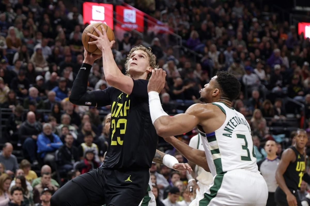 Feb 4, 2024; Salt Lake City, Utah, USA;  Utah Jazz forward Lauri Markkanen (23) looks past Milwaukee Bucks forward Giannis Antetokounmpo (34) and to the basket during the second quarter at Delta Center.