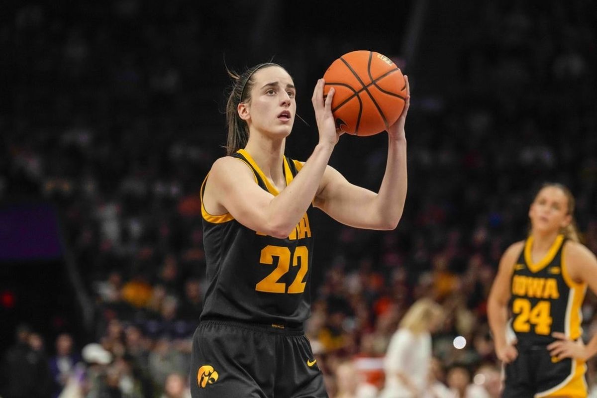 Nov 9, 2023; Charlotte, North Carolina, USA; Iowa Hawkeyes guard Caitlin Clark (22) sets up for a free throw during the second half against the Virginia Tech Hokies at Spectrum Center.