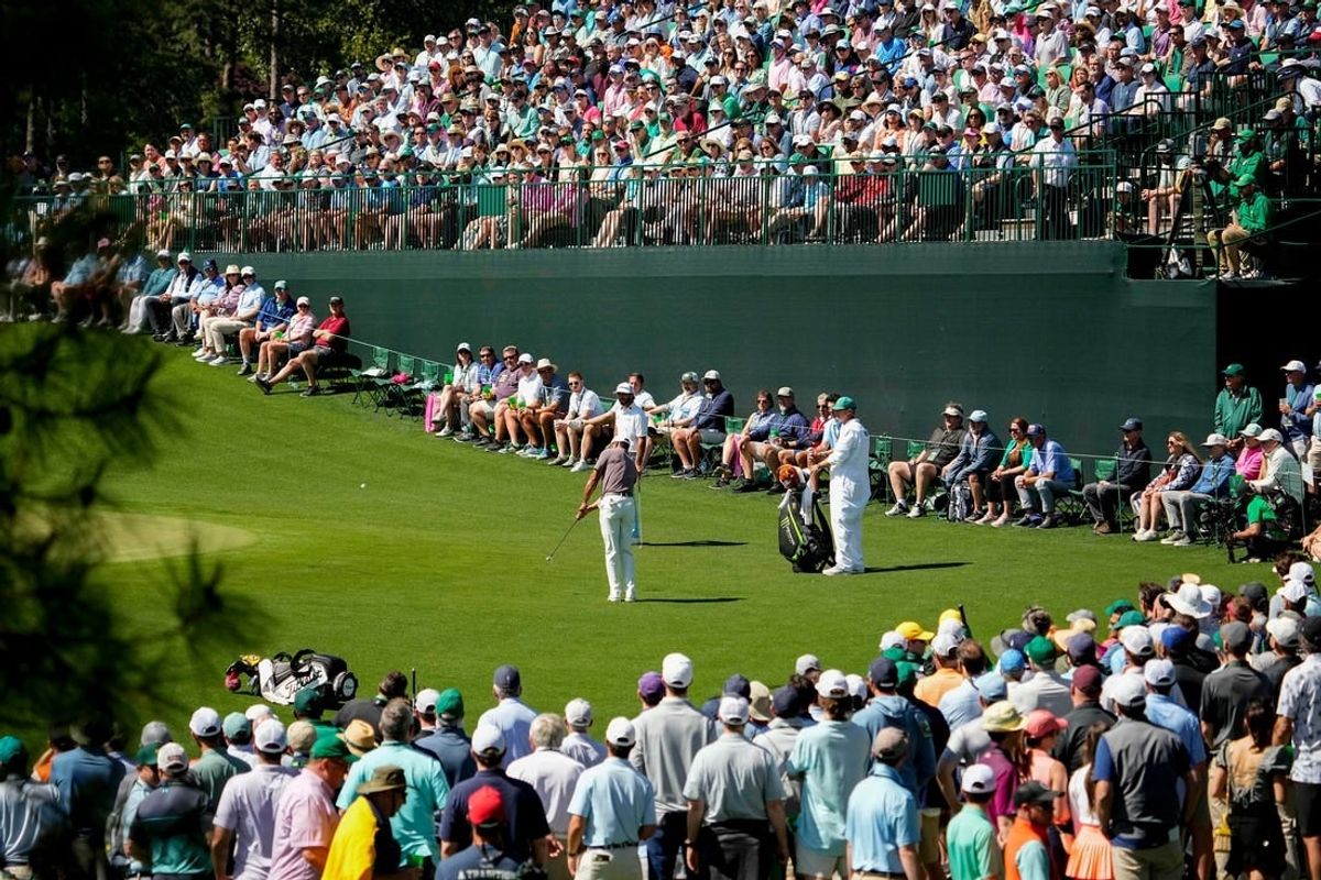 Apr 12, 2024; Augusta, Georgia, USA; Tiger Woods hits onto the no. 17 green during the second round of the Masters Tournament.