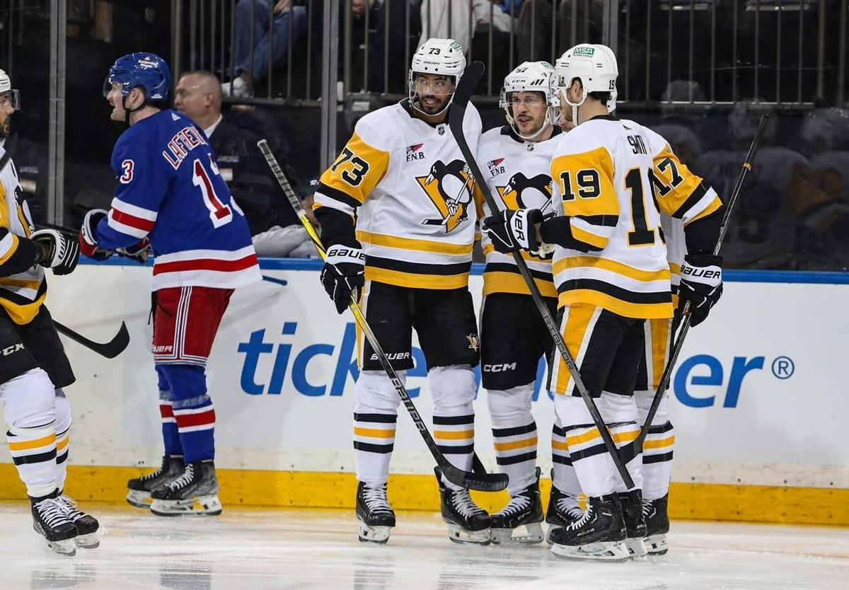 Apr 1, 2024; New York, New York, USA; Pittsburgh Penguins right wing Bryan Rust (17) celebrates his goal with Pittsburgh Penguins center Sidney Crosby (87) during the first period against the New York Rangers at Madison Square Garden.