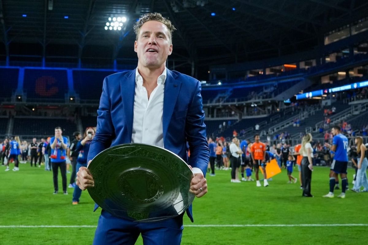 Oct 4, 2023; Cincinnati, Ohio, USA;  FC Cincinnati general manager Chris Albright celebrates with the Supporters Shield at TQL Stadium.