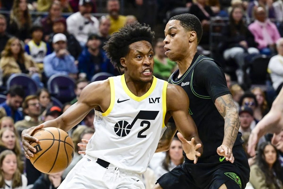 Nov 25, 2023; Salt Lake City, Utah, USA; Utah Jazz guard Collin Sexton (2) dribbles the ball against New Orleans Pelicans guard Jordan Hawkins (24) during the first half at Delta Center.