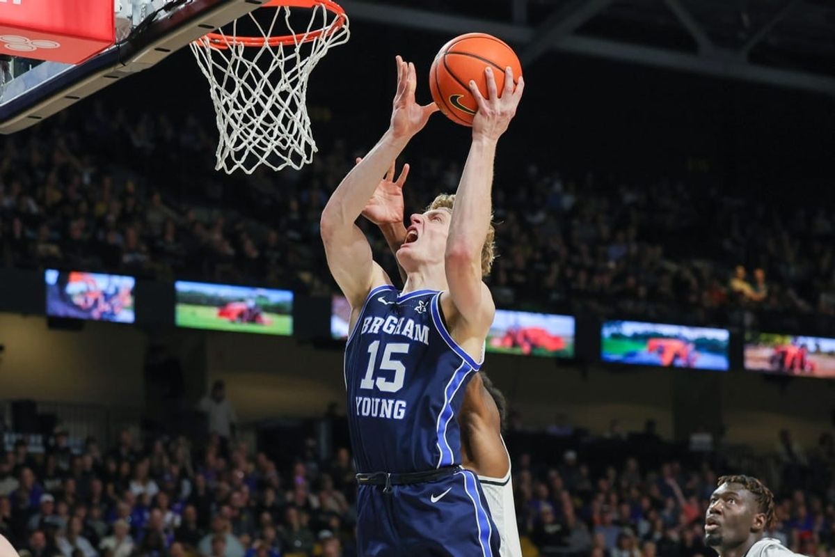 Jan 13, 2024; Orlando, Florida, USA; Brigham Young Cougars guard Richie Saunders (15) goes to the basket during the first period against the UCF Knights at Addition Financial Arena.
