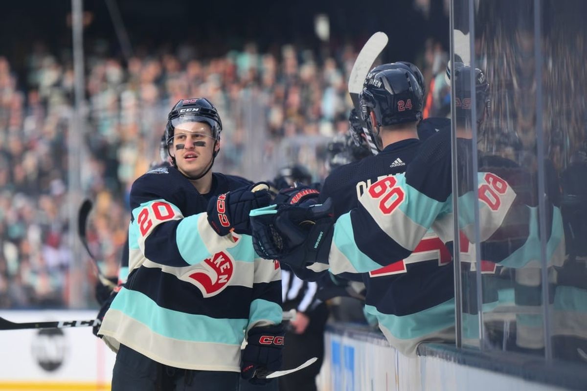 Jan 1, 2024; Seattle, Washington, USA; Seattle Kraken right wing Eeli Tolvanen (20) celebrates with the bench after scoring a goal against the Vegas Golden Knights during the first period in the 2024 Winter Classic ice hockey game at T-Mobile Park.