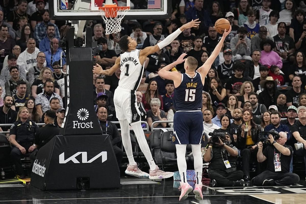 Mar 15, 2024; Austin, Texas, USA; Denver Nuggets center Nikola Jokic (15) shoots over San Antonio Spurs forward Victor Wembanyama (1) during the first half at Moody Center.