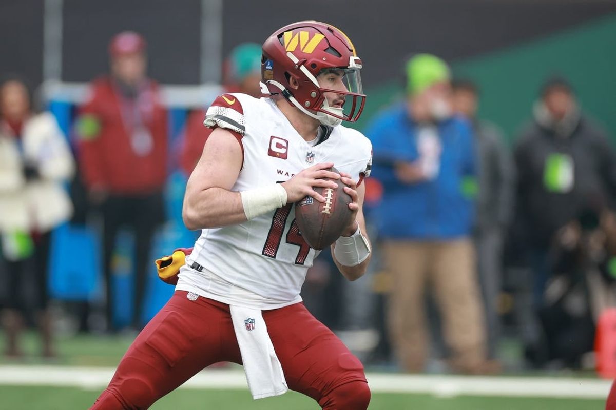 Dec 24, 2023; East Rutherford, New Jersey, USA; Washington Commanders quarterback Sam Howell (14) drops back to pass during the first quarter against the New York Jets at MetLife Stadium.