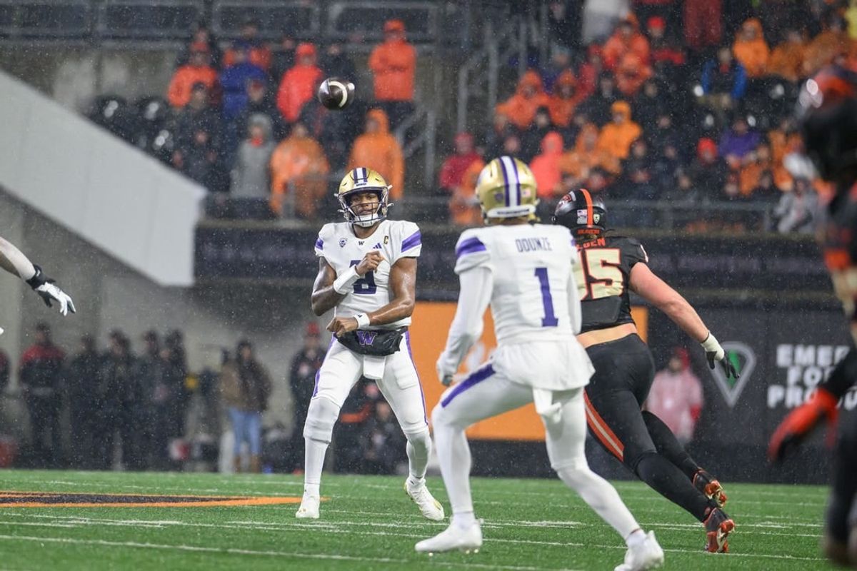 Washington Huskies quarterback Michael Penix Jr. (9) throws a pass to wide receiver Rome Odunze (1) during the second quarter against the Oregon State Beavers at Reser Stadium.