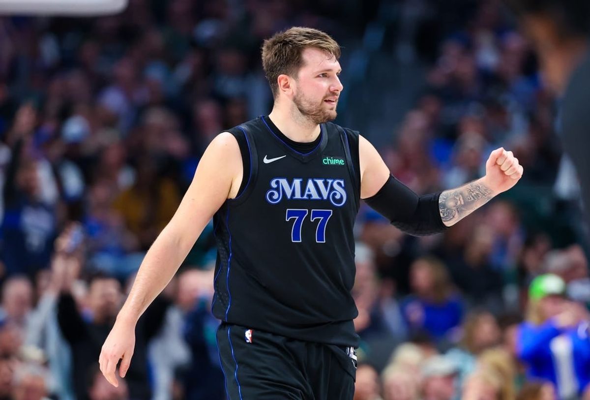 Mar 21, 2024; Dallas, Texas, USA;  Dallas Mavericks guard Luka Doncic (77) reacts during the first half against the Utah Jazz at American Airlines Center.
