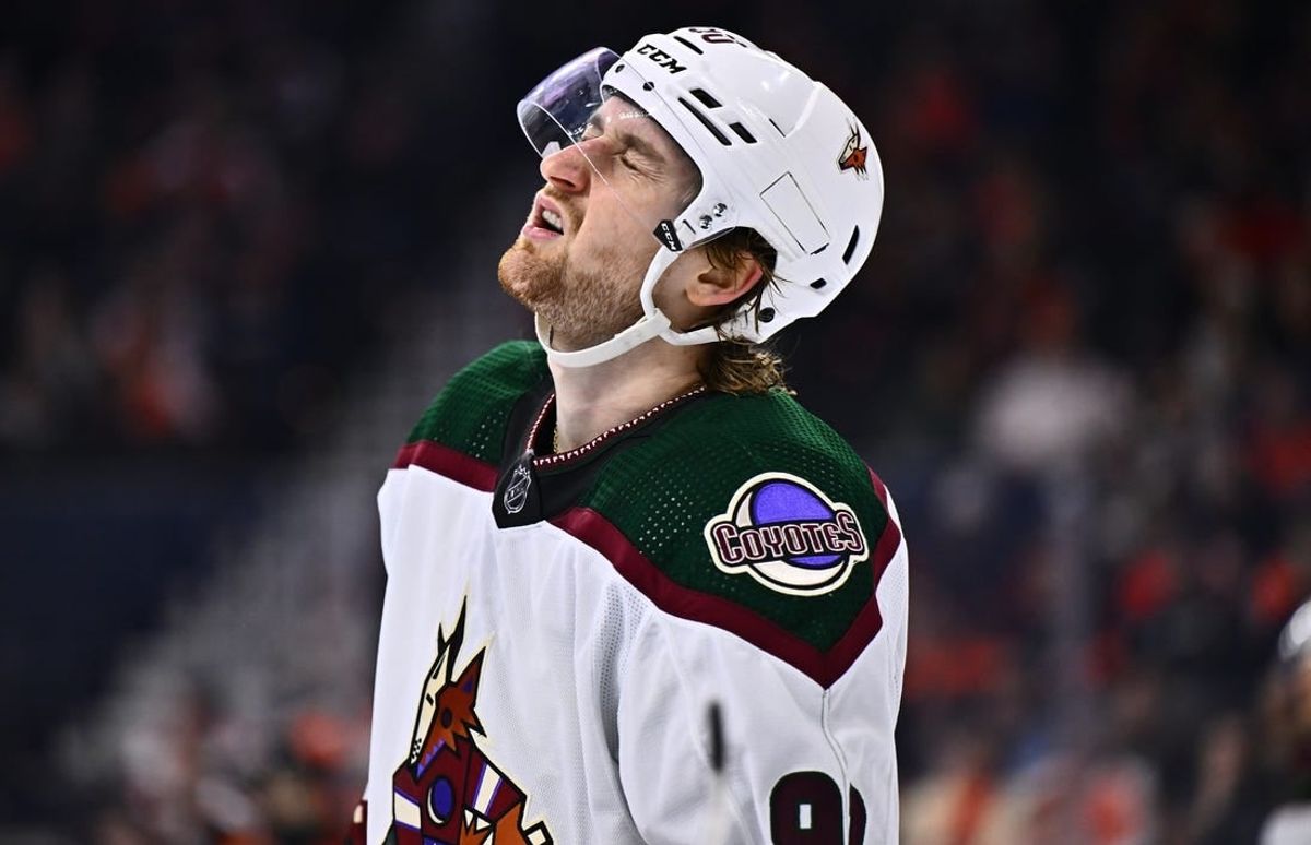 Feb 12, 2024; Philadelphia, Pennsylvania, USA; Arizona Coyotes defenseman J.J. Moser (90) reacts against the Philadelphia Flyers in the third period at Wells Fargo Center.