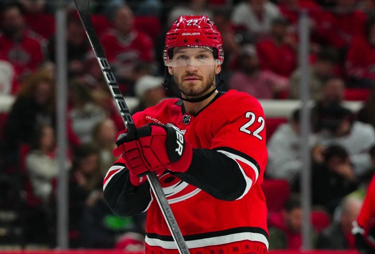Mar 28, 2024; Raleigh, North Carolina, USA;  Carolina Hurricanes defenseman Brett Pesce (22) looks on against the Detroit Red Wings during the second period at PNC Arena.