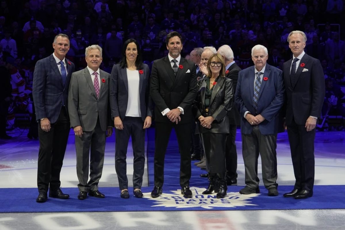 Nov 10, 2023; Toronto, Ontario, CAN; Hockey Hall of Fame Class of 2023 inductees Pierre Turgeon, Mike Vernon, Caroline Ouellette, Henrik Lundqvist, Coco Lacroix for her husband Pierre , Ken Hitchcock, and Tom Barrasso (left to right) before the start of the game between the Calgary Flames and Toronto Maple Leafs  at Scotiabank Arena.