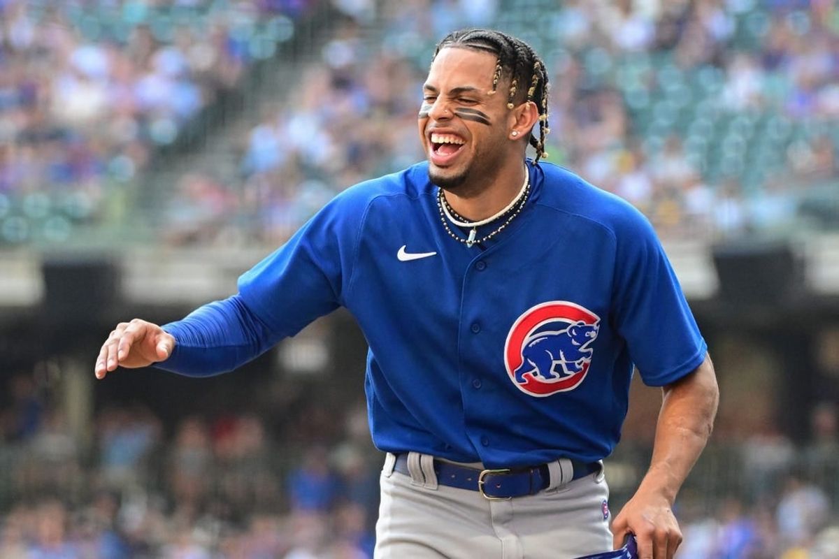 Oct 1, 2023; Milwaukee, Wisconsin, USA; Chicago Cubs shortstop Christopher Morel (5) jokes with teammates between innings against the Milwaukee Brewers at American Family Field.