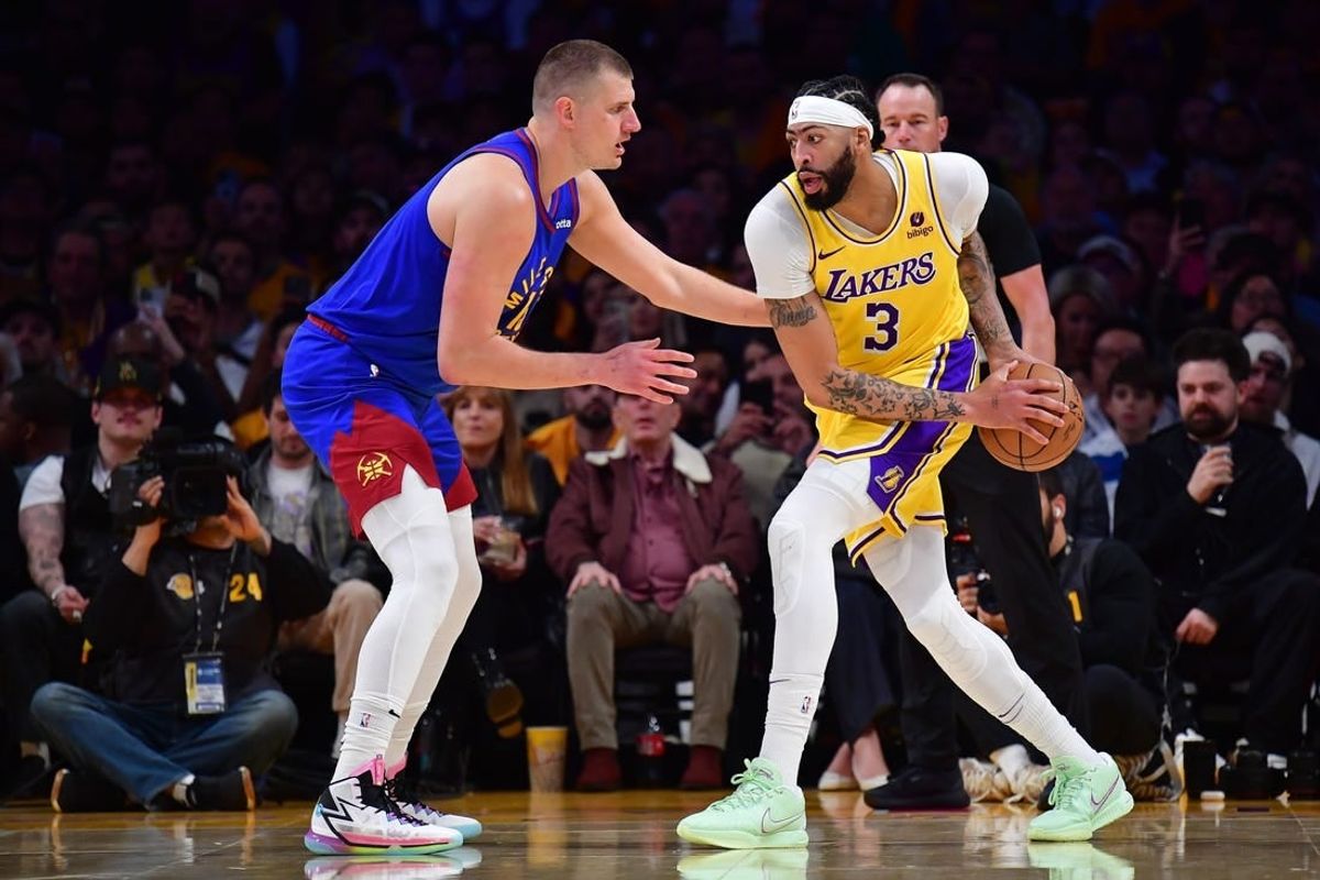 Apr 25, 2024; Los Angeles, California, USA; Los Angeles Lakers forward Anthony Davis (3) controls the ball against Denver Nuggets center Nikola Jokic (15) during the first half in game three of the first round for the 2024 NBA playoffs at Crypto.com Arena.
