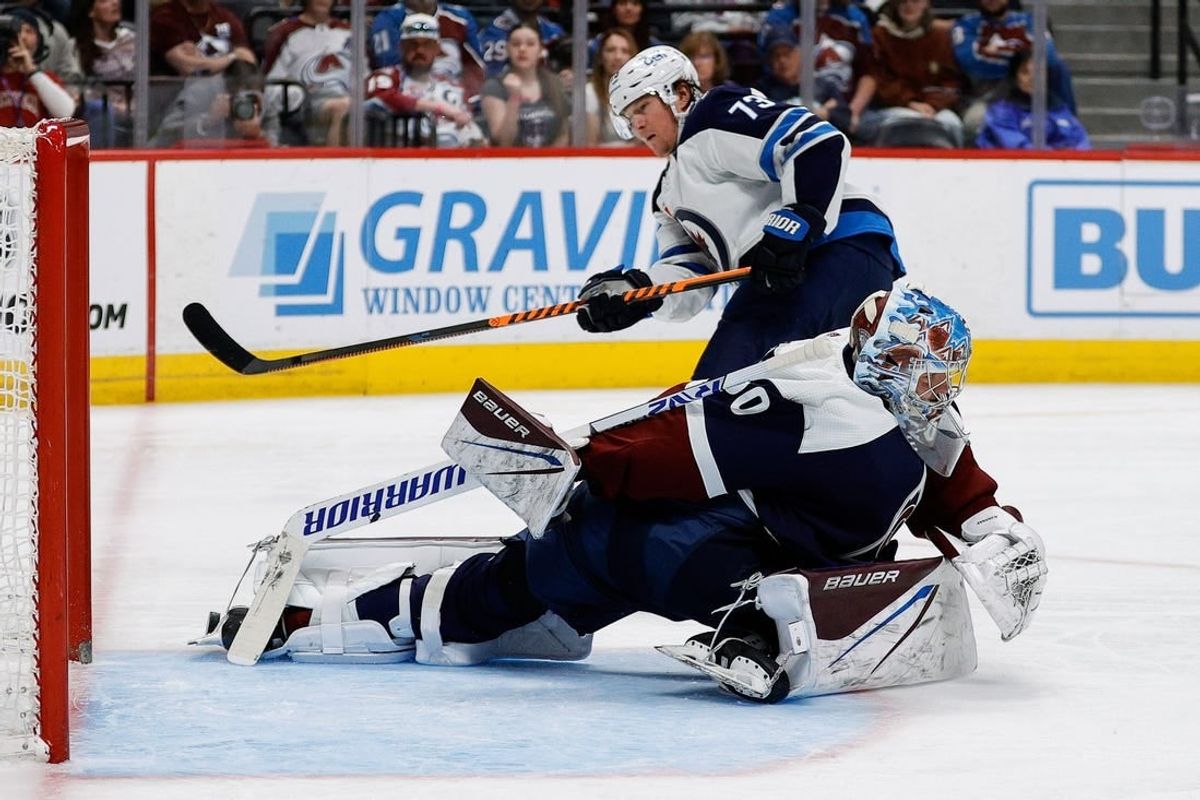 Apr 13, 2024; Denver, Colorado, USA; Colorado Avalanche goaltender Justus Annunen (60) makes a save on a shot from Winnipeg Jets center Tyler Toffoli (73) in the third period at Ball Arena.