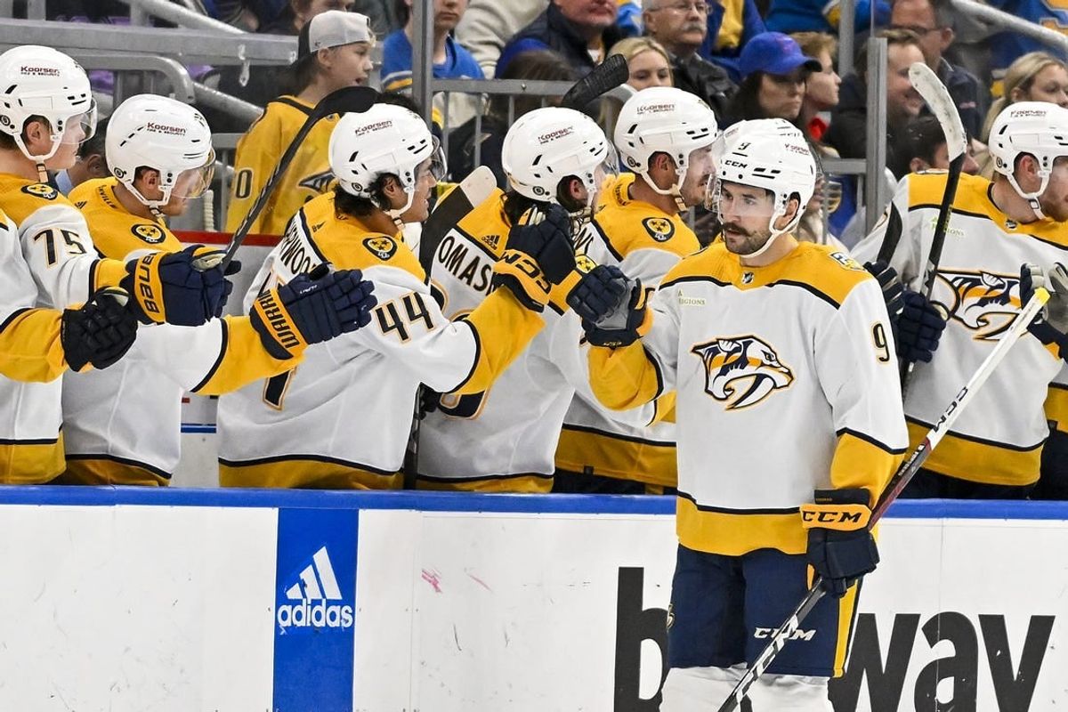 Nov 24, 2023; St. Louis, Missouri, USA;  Nashville Predators left wing Filip Forsberg (9) is congratulated by teammates after scoring against the St. Louis Blues during the second period at Enterprise Center.