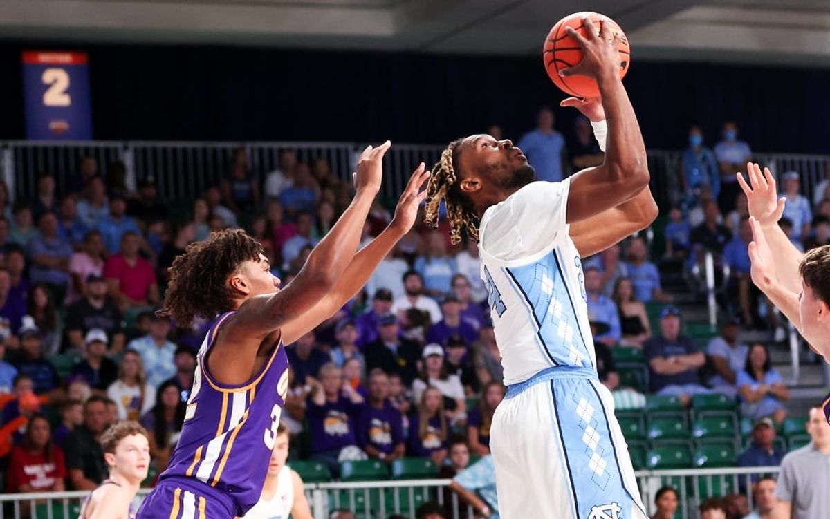 Nov 22, 2023; Paradise Island, BAHAMAS;  North Carolina Tar Heels forward Jae'Lyn Withers (24) scores as Northern Iowa Panthers guard Tytan Anderson (32) defends during the first half at Imperial Arena.