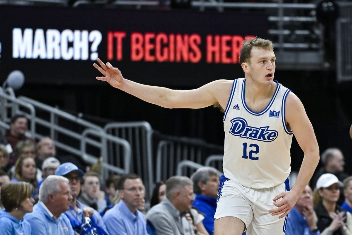 Mar 10, 2024; St. Louis, MO, USA;  Drake Bulldogs guard Tucker DeVries (12) reacts after making a three pointer against the Indiana State Sycamores during the first half of the Missouri Valley Conference Tournament Championship game at Enterprise Center.