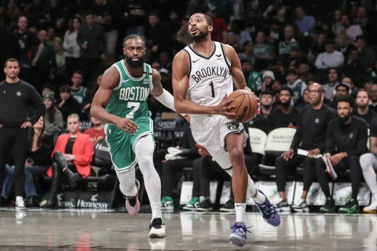 Feb 13, 2024; Brooklyn, New York, USA;  Brooklyn Nets forward Mikal Bridges (1) drives past Boston Celtics guard Jaylen Brown (7) in the third quarter at Barclays Center.