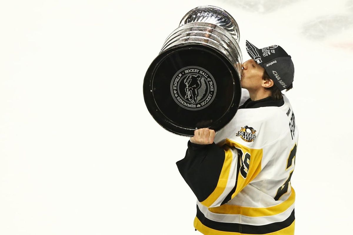 Jun 11, 2017; Nashville, TN, USA; Pittsburgh Penguins goalie Marc-Andre Fleury (29) skates with the Stanley Cup after defeating the Nashville Predators in game six of the 2017 Stanley Cup Final at Bridgestone Arena. Mandatory Credit: Aaron Doster-Imagn Images