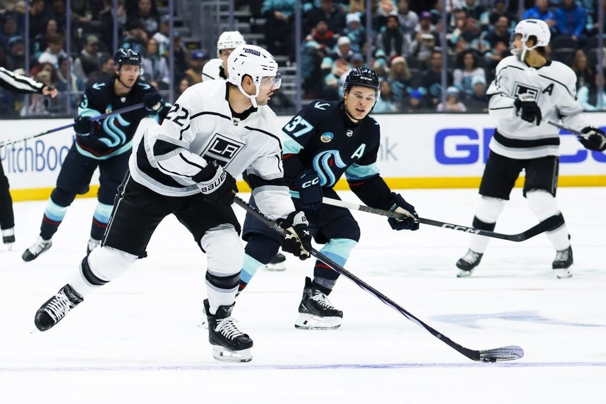 Dec 16, 2023; Seattle, Washington, USA; Los Angeles Kings left wing Kevin Fiala (22) looks to pass the puck against the Seattle Kraken during the second period at Climate Pledge Arena.