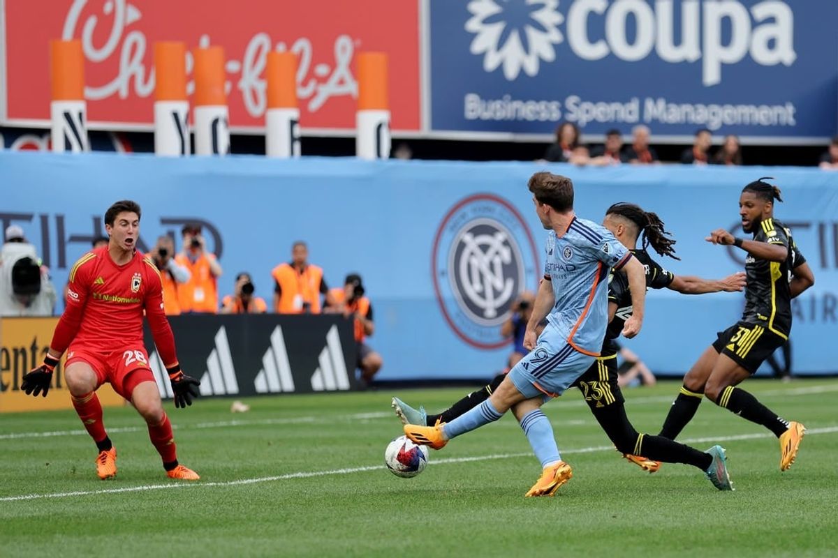 Jun 17, 2023; New York, New York, USA; New York City FC forward Gabriel Segal (19) scores a goal against Columbus Crew SC goalkeeper Patrick Schulte (28) and defenders Mohamed Farsi (23) and Steven Moreira (31) during the second half at Yankee Stadium.