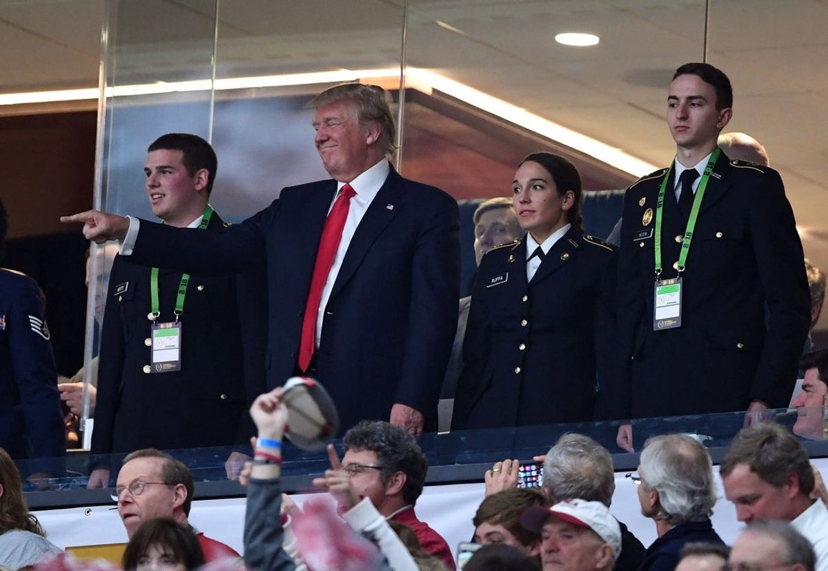 Jan 8, 2018; Atlanta, GA, USA; President Donald Trump waves during the first quarter of the 2018 CFP national championship college football game between the Georgia Bulldogs and the Alabama Crimson Tide at Mercedes-Benz Stadium. Mandatory Credit: John David Mercer-Imagn Images